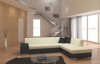 Modernes L-Sofa in Creme und Schwarz in lichtdurchflutetem Raum