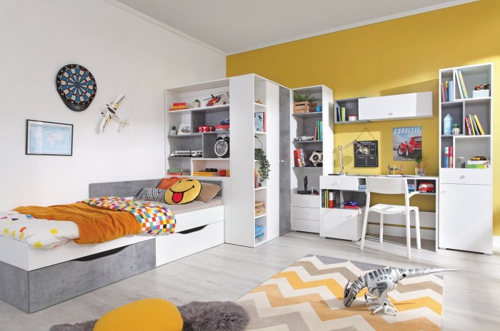 Stilvolles Jugendzimmer-Set mit Bett und viel Stauraum vor gelber Akzentwand.