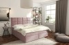 Rosa Boxspringbett mit quadratischer Steppung und Schubladen im hellen Schlafzimmer.