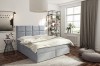 Hellblaues Boxspringbett mit funktionalen Schubladen in modernem Schlafzimmer-Design.