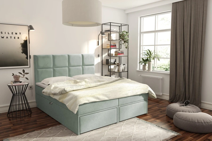 Modernes Polsterbett in Mintgrün mit gestepptem Kopfteil und praktischen Schubladen im hellen Schlafzimmer.
