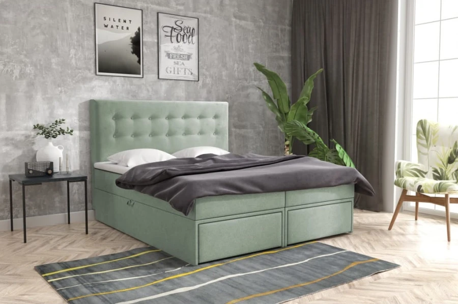 Mintgrünes Polsterbett mit dekorativer Knopfheftung und integrierten Bettkasten-Schubladen.