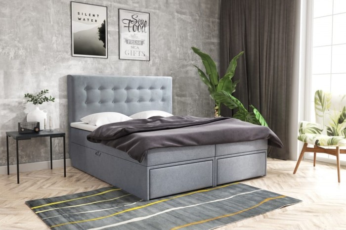 Hellblaues Polsterbett mit Stauraumschubladen und gestepptem Design.