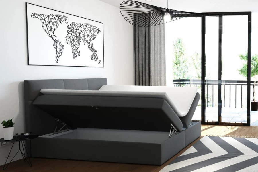 Graues Boxspringbett mit aufklappbarem Bettkasten für Stauraum im Schlafzimmer