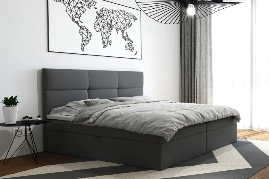 Modernes graues Boxspringbett mit gepolstertem Kopfteil im hellen Schlafzimmer