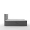 Seitenansicht eines modernen grauen Boxspringbetts mit Kopfteil.