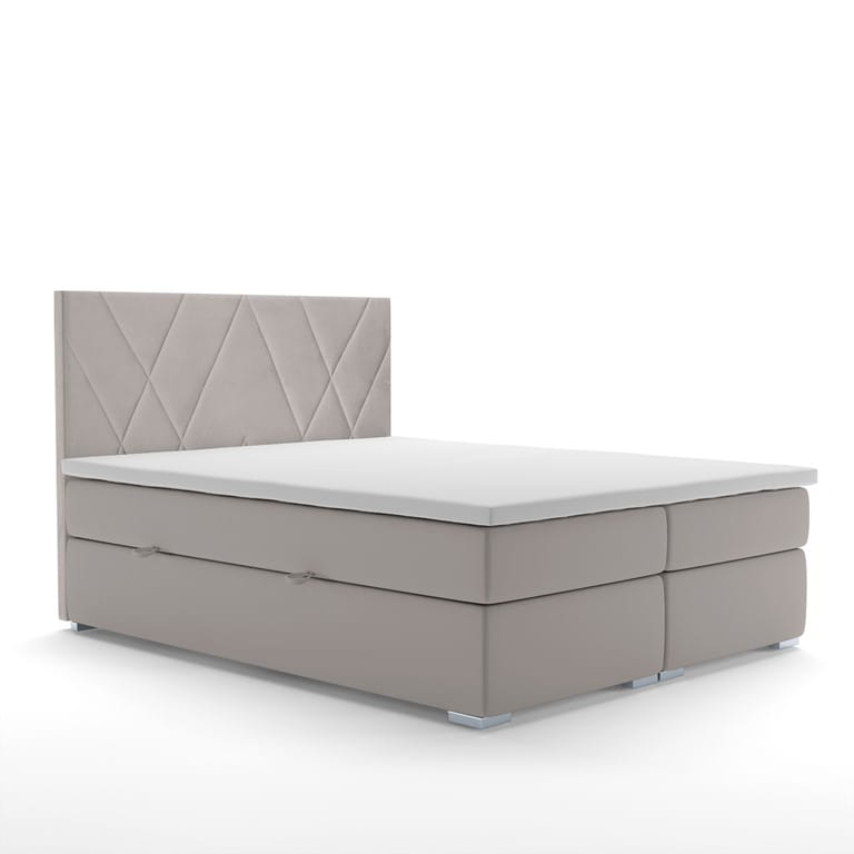 Modernes beiges Boxspringbett mit geometrisch gestepptem Kopfteil.