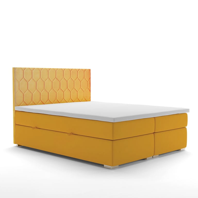 Gelbes Boxspringbett mit gestepptem Kopfteil in Wabenoptik auf weißem Hintergrund.