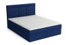 Modernes blaues Boxspringbett mit gepolstertem Kopfteil und weißer Matratzenauflage