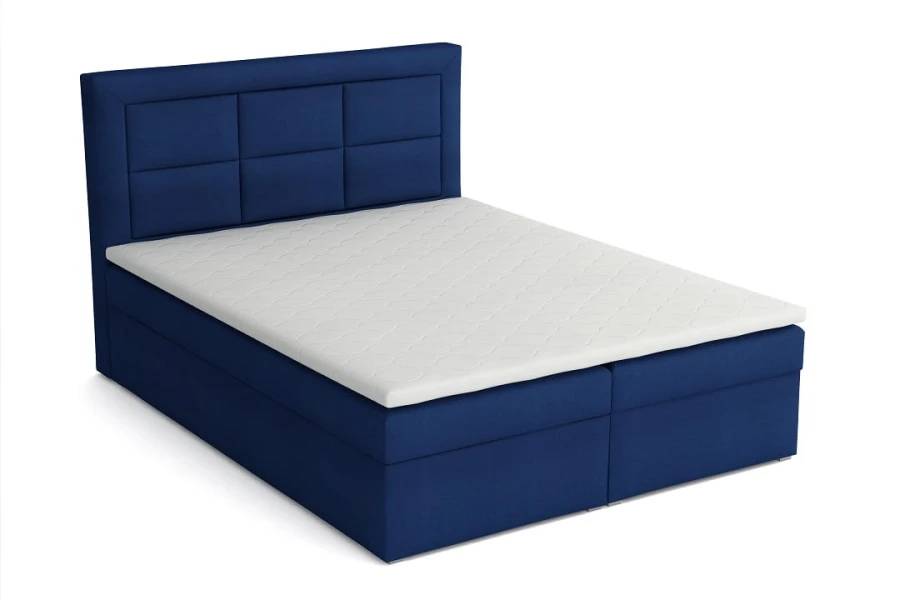 Modernes blaues Boxspringbett mit gepolstertem Kopfteil und weißer Matratzenauflage