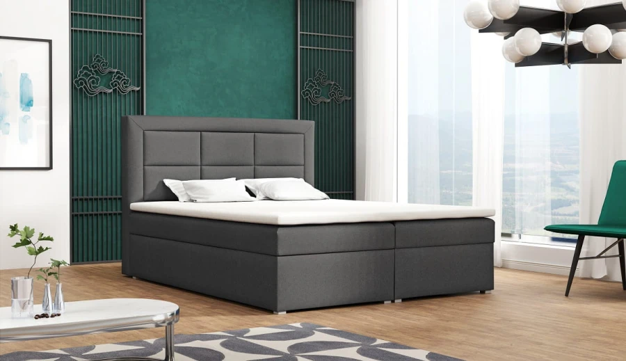 Dunkelgraues Boxspringbett mit gestepptem Kopfteil im modernen Design für komfortablen Schlaf.