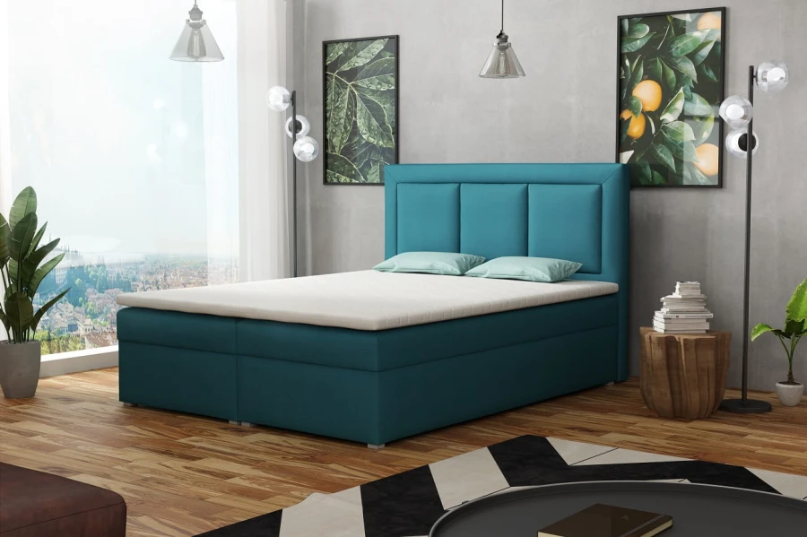 Modernes Boxspringbett in Türkis im Schlafzimmer mit Parkettboden und Deko