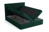 Grünes Boxspringbett mit geöffneten Bettkästen für zusätzlichen Stauraum.