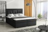 Modernes schwarzes Boxspringbett mit gepolstertem Kopfteil im Schlafzimmer.