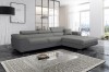 Modernes L-Form Sofa in verschiedenen Grautönen mit verstellbaren Nackenstützen.