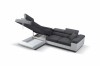 Grau-weißes Ecksofa mit Bettkasten und Stauraum, aufgeklappt.