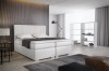 Weißes Boxspringbett in elegantem Design für moderne Schlafzimmer.