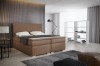 Braunes Boxspringbett in hochwertiger Optik für gemütlichen Schlafkomfort.