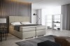 Modernes Boxspringbett in Beige im hellen Schlafzimmer.