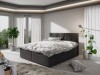 Elegantes anthrazitfarbenes Boxspringbett in einem modern gestalteten Schlafzimmer.