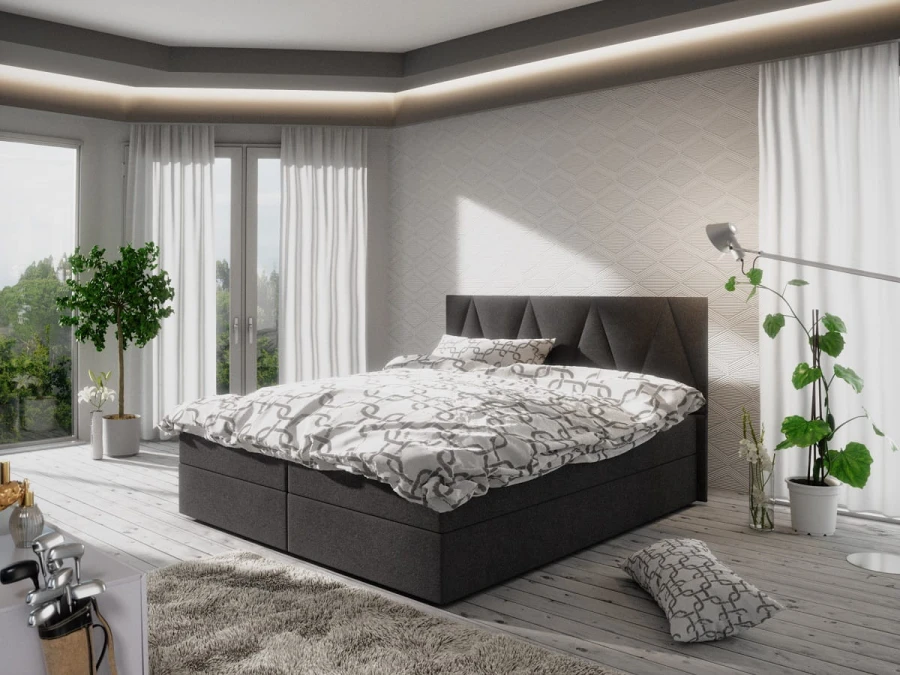 Anthrazitfarbenes Boxspringbett mit weißer Bettwäsche in modernem Ambiente.