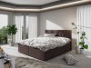 Braunes Boxspringbett mit modernem Polster-Kopfteil in hellem Schlafzimmer.