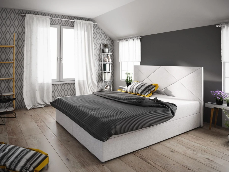 Modernes weißes Boxspringbett mit dekorativem Kopfteil im Schlafzimmer.