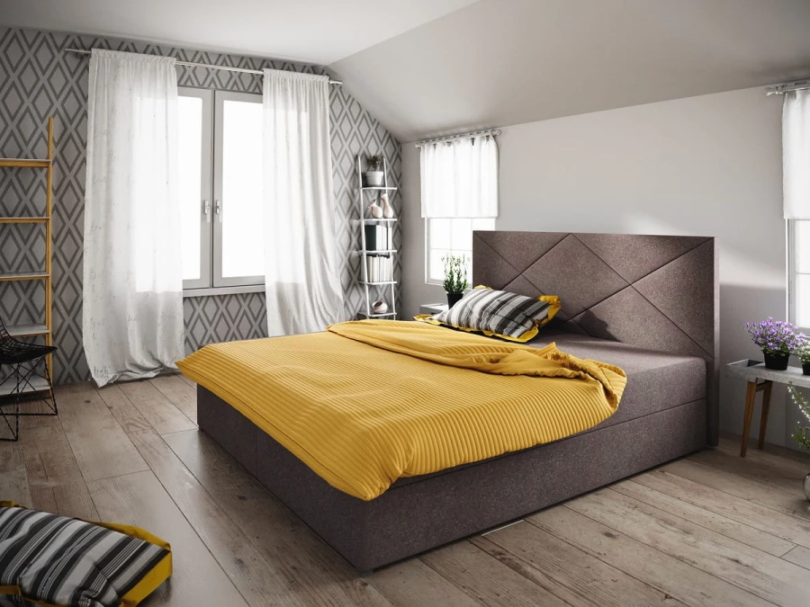 Braunes Boxspringbett mit gelber Bettwäsche in modernem Ambiente.
