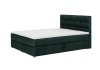 Dunkelgrünes Boxspringbett mit weißer Matratze und hohem Polster-Kopfteil.