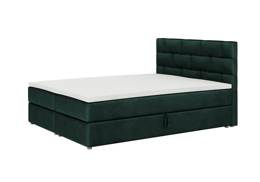 Dunkelgrünes Boxspringbett mit weißer Matratze und hohem Polster-Kopfteil.