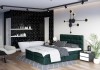 Grünes Boxspringbett in modernem Schlafzimmer mit freistehender Badewanne und schwarzer Akzentwand.