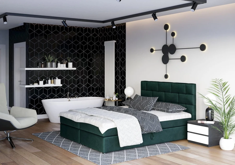 Grünes Boxspringbett in modernem Schlafzimmer mit freistehender Badewanne und schwarzer Akzentwand.