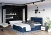 Dunkelblaues Boxspringbett in stilvollem Schlafzimmer mit Badewanne und modernen Designelementen.