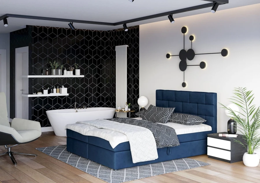 Dunkelblaues Boxspringbett in stilvollem Schlafzimmer mit Badewanne und modernen Designelementen.