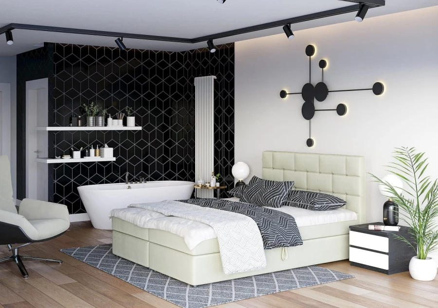 Beiges Boxspringbett in hellem, modernem Schlafzimmer mit integriertem Badbereich und Wanddeko.