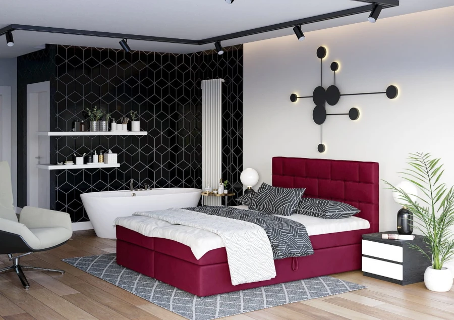 Elegantes weinrotes Boxspringbett in modernem Schlafzimmer-Design mit integriertem Bad.