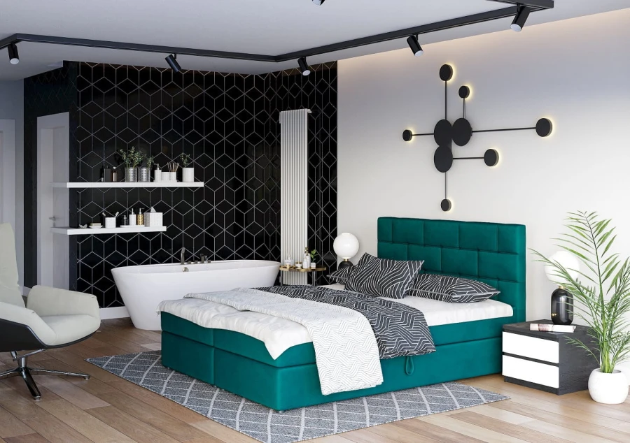 Stilvolles smaragdgrünes Boxspringbett vor schwarzer Mosaikwand im modernen Schlafzimmer.