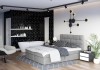 Modernes hellgraues Boxspringbett in offenem Schlafzimmer mit Badewanne und Parkett.