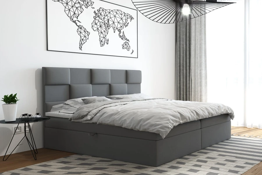 Graues Boxspringbett mit gepolstertem Kopfteil in modernem Schlafzimmer