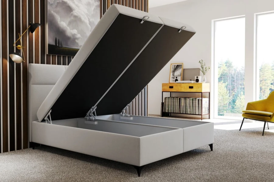 Weißes Boxspringbett mit offenem Bettkasten für extra Stauraum im modernen Schlafzimmer.