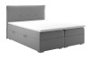 Klassisches Boxspringbett in Grau mit weißem Topper und Steppung am Kopfteil.