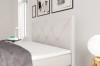 Nahaufnahme eines beigen Kopfteils mit Rautensteppung für ein Boxspringbett in modernem Design.