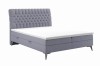Lila Boxspringbett mit gestepptem Kopfteil und modernen Metallfüßen
