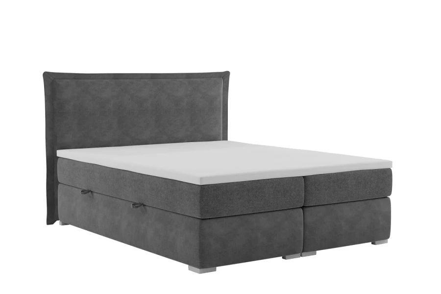 Schlichtes graues Boxspringbett mit gepolstertem Kopfteil auf weißem Hintergrund.