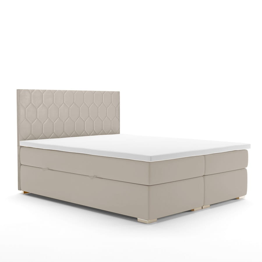 Modernes beiges Boxspringbett mit Kopfteil im Wabenmuster auf weißem Hintergrund.