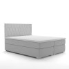 Modernes hellgraues Boxspringbett mit Wabenmuster-Kopfteil auf weißem Hintergrund.