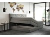 Graues Boxspringbett mit offenem Bettkasten für zusätzlichen Stauraum im modernen Schlafzimmer.
