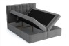 Boxspringbett in Grau mit aufklappbarem Bettkasten als Stauraum.
