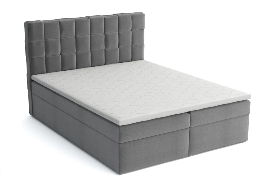Modernes graues Boxspringbett mit gestepptem Kopfteil und weißem Topper.