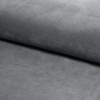 Nahaufnahme der grauen Stofftextur eines Boxspringbettes.